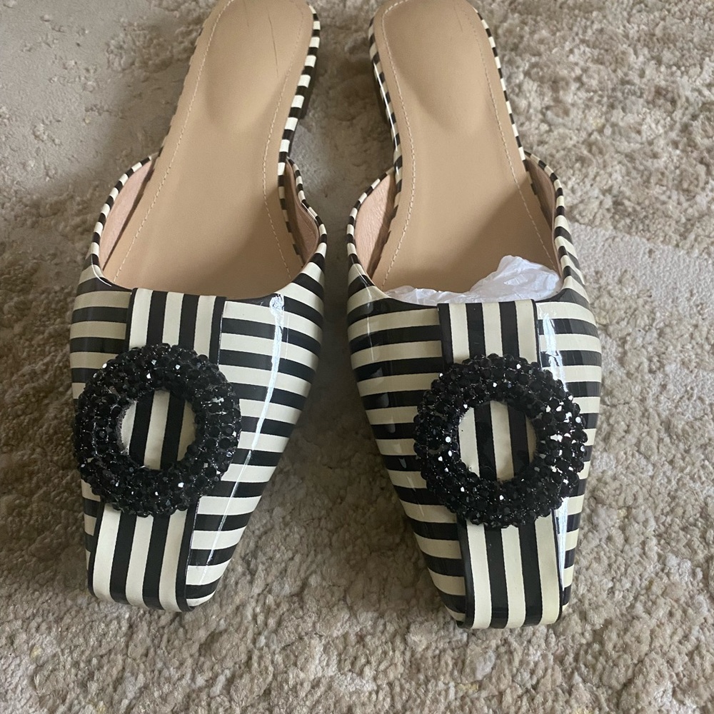 Black and cream stripped mules with black dressy bow.